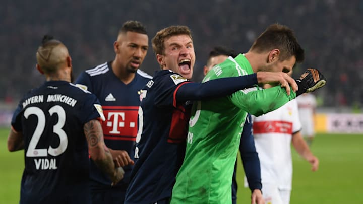 STUTTGART, GERMANY - DECEMBER 16: Sven Ulreich of Bayern Muenchen is congratulated by Thomas Mueller of Bayern Muenchen after he saved a penalty against Chadrac Akolo of Stuttgart (back) during the Bundesliga match between VfB Stuttgart and FC Bayern Muenchen at Mercedes-Benz Arena on December 16, 2017 in Stuttgart, Germany. (Photo by Matthias Hangst/Bongarts/Getty Images)