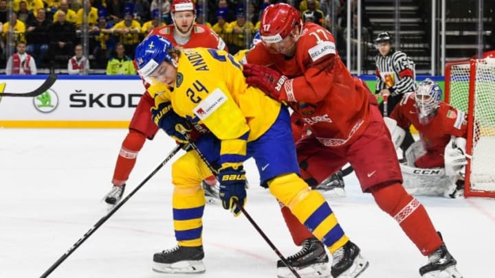 Belarus' Yegor Sharangovich (R) and Sweden's Lias Andersson fight for the puck during the 2018 IIHF Men's Ice Hockey World Championship match between Sweden and Belarus on May 4, 2018 in Copenhagen. (Photo by Jonathan NACKSTRAND / AFP) (Photo credit should read JONATHAN NACKSTRAND/AFP/Getty Images)
