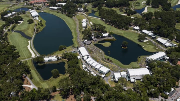 PONTE VEDRA BEACH, FL – MAY 09: (L-R) An aerial course overview as fans watch play on the ninth, 18th, 17th and 16th holes during the third round of THE PLAYERS Championship on THE PLAYERS Stadium Course at TPC Sawgrass on May 9, 2015 in Ponte Vedra Beach, Florida. (Photo by Chris Condon/PGA TOUR)