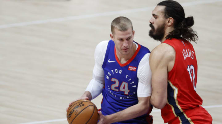Detroit Pistons center Mason Plumlee (24) is defended by New Orleans Pelicans center Steven Adams (12) at Little Caesars Arena. Mandatory Credit: Rick Osentoski-USA TODAY Sports