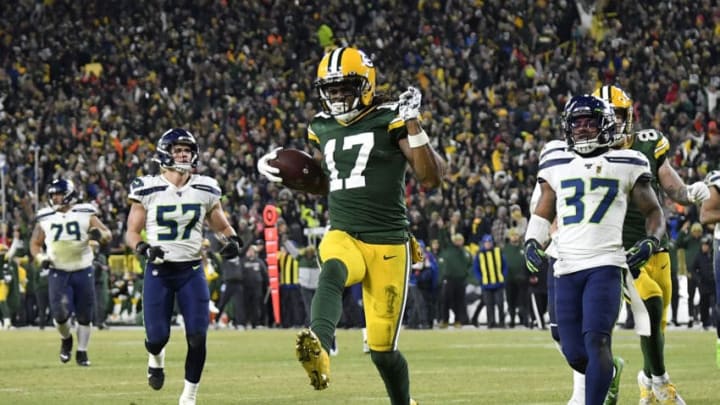 GREEN BAY, WISCONSIN - JANUARY 12: Davante Adams #17 of the Green Bay Packers runs in a 40-yard touchdown catch against the Seattle Seahawks in the third quarter of the NFC Divisional Playoff game at Lambeau Field on January 12, 2020 in Green Bay, Wisconsin. (Photo by Quinn Harris/Getty Images)