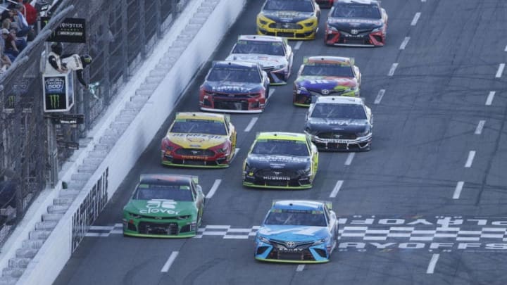 MARTINSVILLE, VIRGINIA - OCTOBER 27: Martin Truex Jr, driver of the #19 Auto Owners Insurance Toyota, leads a pack of cars during the Monster Energy NASCAR Cup Series First Data 500 at Martinsville Speedway on October 27, 2019 in Martinsville, Virginia. (Photo by Brian Lawdermilk/Getty Images)