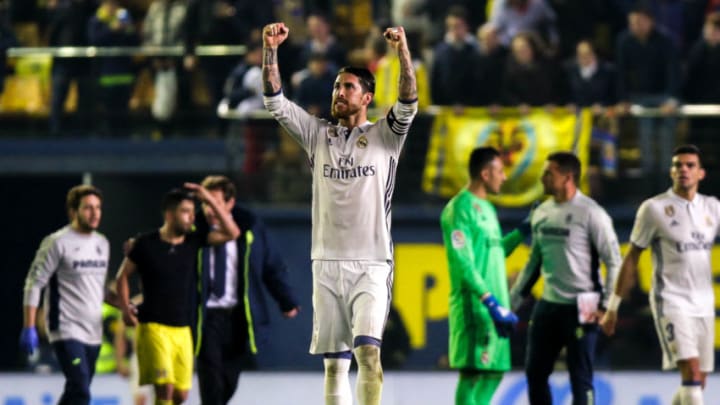 Real Madrid's defender, Sergio Ramos, celebrates at the end of the Spanish League football match Villarreal CF vs Real Madrid at El Madrigal stadium in Vila-real on February 26, 2017. / AFP / BIEL ALINO (Photo credit should read BIEL ALINO/AFP/Getty Images)