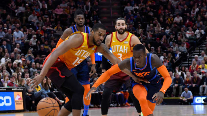 SALT LAKE CITY, UT - DECEMBER 22: Derrick Favors #15 of the Utah Jazz and Dennis Schroder #17 of the Oklahoma City Thunder go for the loose ball in the second half of a NBA game at Vivint Smart Home Arena on December 22, 2018 in Salt Lake City, Utah. NOTE TO USER: User expressly acknowledges and agrees that, by downloading and or using this photograph, User is consenting to the terms and conditions of the Getty Images License Agreement. (Photo by Gene Sweeney Jr./Getty Images)