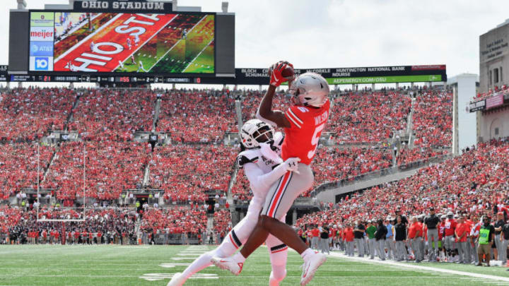 COLUMBUS, OH - SEPTEMBER 7: Garrett Wilson #5 of the Ohio State Buckeyes catches a 9-yard touchdown pass over the defense of Coby Bryant #7 of the Cincinnati Bearcats in the second quarter at Ohio Stadium on September 7, 2019 in Columbus, Ohio. (Photo by Jamie Sabau/Getty Images)