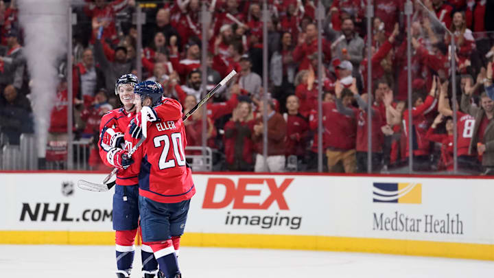 WASHINGTON, DC – APRIL 11: Lars Eller #20 of the Washington Capitals celebrates with John Carlson #74 after scoring an empty net goal in the third period against the Carolina Hurricanes in Game One of the Eastern Conference First Round during the 2019 NHL Stanley Cup Playoffs at Capital One Arena on April 11, 2019 in Washington, DC. (Photo by Patrick McDermott/NHLI via Getty Images)