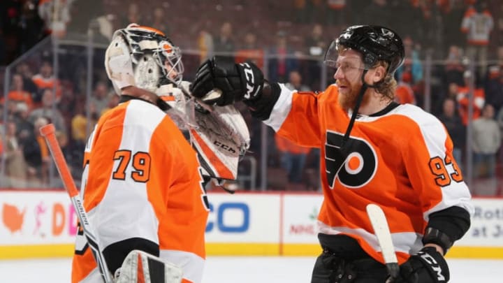 PHILADELPHIA, PENNSYLVANIA - DECEMBER 20: Carter Hart #79 and Jakub Voracek #93 of the Philadelphia Flyers celebrate their 2-1 victory over the Nashville Predators at the Wells Fargo Center on December 20, 2018 in Philadelphia, Pennsylvania. (Photo by Bruce Bennett/Getty Images)