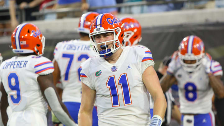 Florida quarterback Kyle Trask (11) yells in celebration are throwing his fourth touchdown of the first half during the annual Florida Georgia rivalry game held at TIAA Bank Field in Jacksonville Fla. Nov. 7, 2020.Florida Georgia Football 38