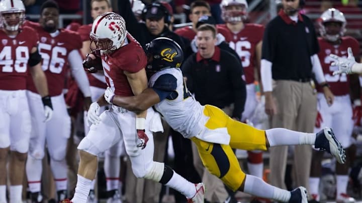 Nov 21, 2015; Stanford, CA, USA; California Golden Bears linebacker Hardy Nickerson (47) tackles Stanford Cardinal running back Christian McCaffrey (5) during the first quarter at Stanford Stadium. Mandatory Credit: Kelley L Cox-USA TODAY Sports