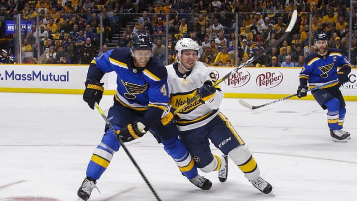 NASHVILLE, TENNESSEE - FEBRUARY 16: Carl Gunnarsson #4 of the St. Louis Blues gets tied up with Matt Duchene #95 of the Nashville Predators during the first period at Bridgestone Arena on February 16, 2020 in Nashville, Tennessee. (Photo by Frederick Breedon/Getty Images)
