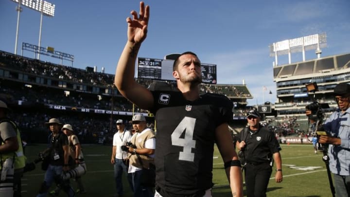 Oct 9, 2016; Oakland, CA, USA; Oakland Raiders quarterback Derek Carr (4) waves to the crowd after the game against the San Diego Chargers at Oakland Coliseum. The Raiders defeated the Chargers 34-31. Mandatory Credit: Cary Edmondson-USA TODAY Sports