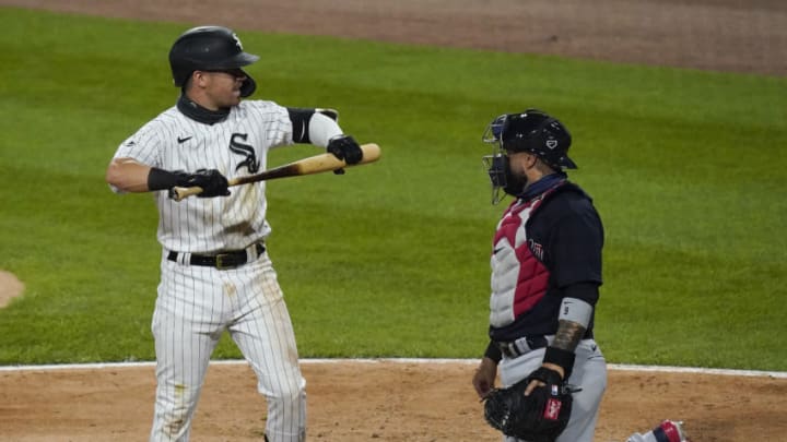 CHICAGO, ILLINOIS - AUGUST 07: Danny Mendick #20 of the Chicago White Sox reacts in front of Sandy Leon #9 of the Cleveland Indians after striking out during the fifth inning on August 07, 2020 in Chicago, Illinois. (Photo by Nuccio DiNuzzo/Getty Images)