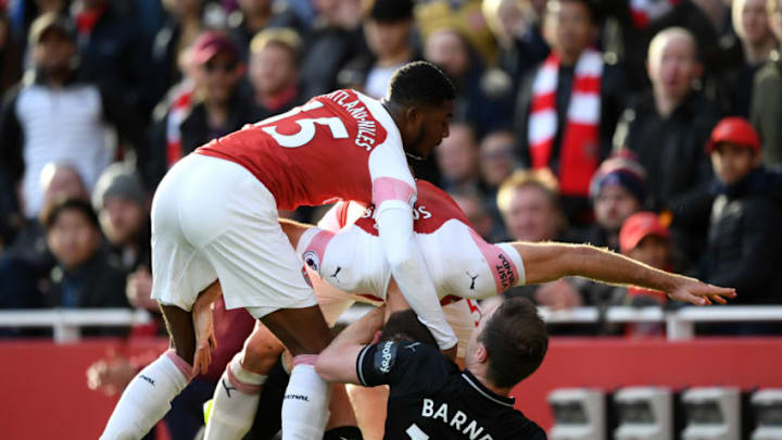 LONDON, ENGLAND - DECEMBER 22: Sokratis Papastathopoulos and Ainsley Maitland-Niles of Arsenal clash with Ashley Barnes of Burnley during the Premier League match between Arsenal FC and Burnley FC at Emirates Stadium on December 22, 2018 in London, United Kingdom. (Photo by Shaun Botterill/Getty Images)