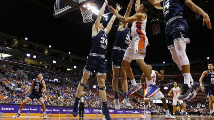 SUNRISE, FLORIDA - DECEMBER 21: Keyontae Johnson #11 of the Florida Gators shot is blocked by Trevin Dorius #32 of the Utah State Aggies during the first half of the Orange Bowl Basketball Classic at BB&T Center on December 21, 2019 in Sunrise, Florida. (Photo by Michael Reaves/Getty Images)