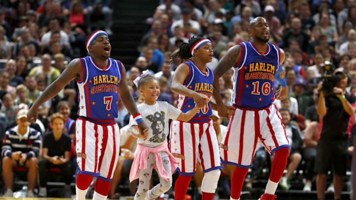 SYDNEY, AUSTRALIA - APRIL 15: Globetrotters players play with a little girl during the Harlem Globetrotters World Tour at Qudos Bank Arena on April 15, 2018 in Sydney, Australia. (Photo by Daniel Munoz/Getty Images)