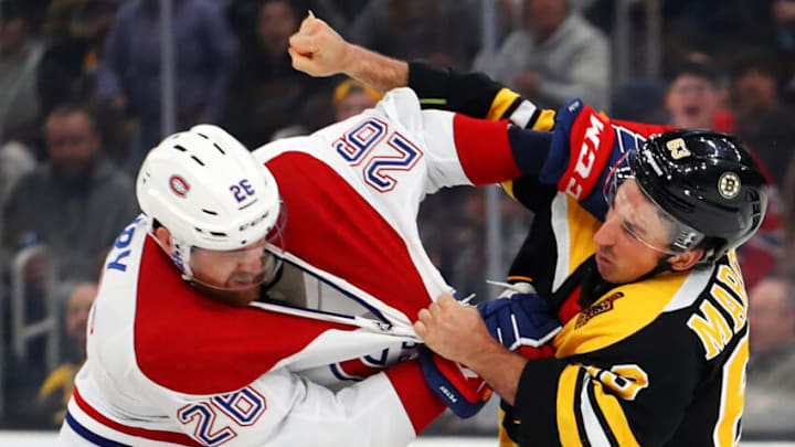 BOSTON, MASSACHUSETTS - FEBRUARY 12: Brad Marchand #63 of the Boston Bruins fights Jeff Petry #26 of the Montreal Canadiens during the first period at TD Garden on February 12, 2020 in Boston, Massachusetts. (Photo by Maddie Meyer/Getty Images)