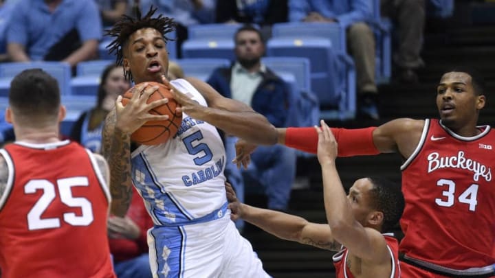 CHAPEL HILL, NORTH CAROLINA - DECEMBER 04: Armando Bacot #5 of the North Carolina Tar Heels battles CJ Walker #13 of the Ohio State Buckeyes for a rebound during the first half of their game at the Dean Smith Center on December 04, 2019 in Chapel Hill, North Carolina. (Photo by Grant Halverson/Getty Images)