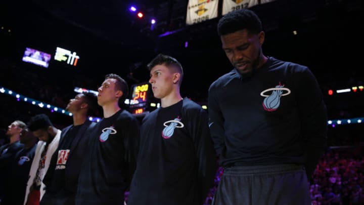 Tyler Herro #14 and Udonis Haslem #40 of the Miami Heat observe the playing of the national anthem prior to the game against the Golden State Warriors. (Photo by Michael Reaves/Getty Images)