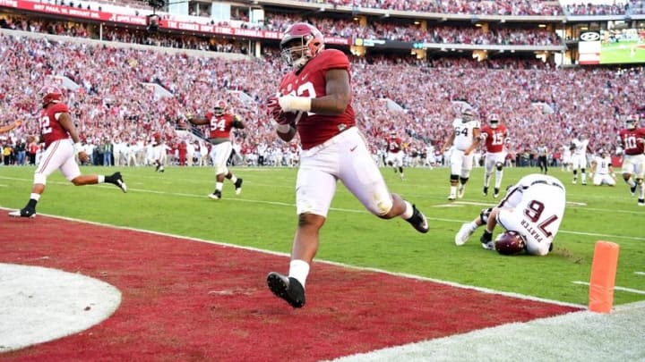 Oct 22, 2016; Tuscaloosa, AL, USA; Alabama Crimson Tide defensive lineman Jonathan Allen (93) returns a fumble for a touchdown against the Texas A&M Aggies during the third quarter at Bryant-Denny Stadium. Mandatory Credit: John David Mercer-USA TODAY Sports