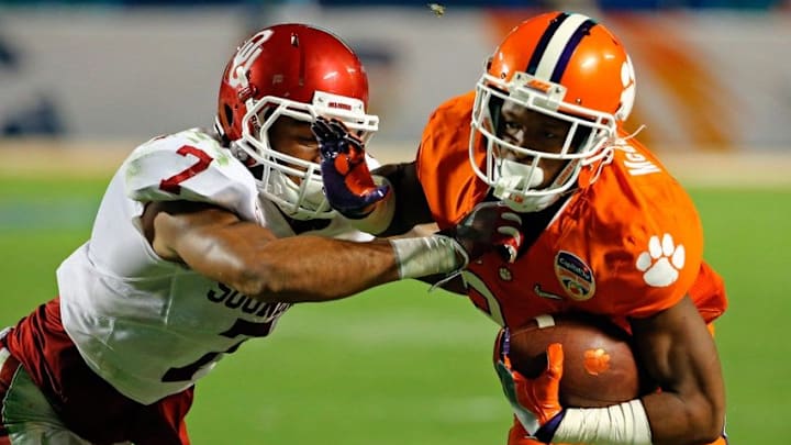 Dec 31, 2015; Miami Gardens, FL, USA; Clemson Tigers wide receiver Ray-Ray McCloud (34) carries the ball as Oklahoma Sooners cornerback Jordan Thomas (7) makes the tackle during the third quarter of the 2015 CFP semifinal at the Orange Bowl at Sun Life Stadium. Mandatory Credit: Steve Mitchell-USA TODAY Sports