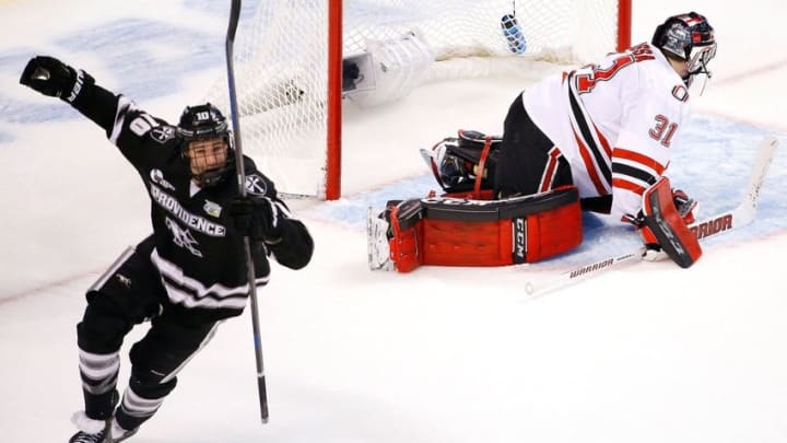 Apr 9, 2015; Boston, MA, USA; Providence College Friars forward Mark Jankowski (10) celebrates his goal on Nebraska-Omaha Mavericks goaltender Ryan Masa (31) during the second period of a semifinal game in the men