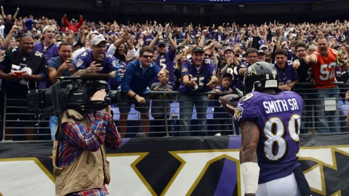 Sep 27, 2015; Baltimore, MD, USA; Baltimore Ravens wide receiver Steve Smith (89) gives a ball to a fan after scoring a touchdown during the third quarter against the Cincinnati Bengals at M&T Bank Stadium. Mandatory Credit: Tommy Gilligan-USA TODAY Sports