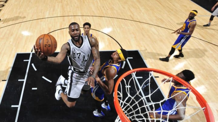 SAN ANTONIO, TX - MARCH 11: Jonathon Simmons #17 of the San Antonio Spurs goes up for a lay up against the Golden State Warriors on March 11, 2017 at the AT&T Center in San Antonio, Texas. NOTE TO USER: User expressly acknowledges and agrees that, by downloading and or using this photograph, user is consenting to the terms and conditions of the Getty Images License Agreement. Mandatory Copyright Notice: Copyright 2017 NBAE (Photos by Mark Sobhani/NBAE via Getty Images)