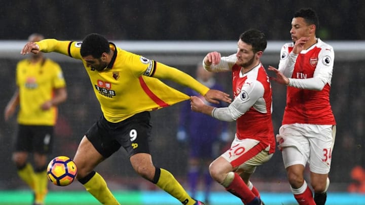 LONDON, ENGLAND - JANUARY 31: Troy Deeney of Watford and Shkodran Mustafi of Arsenal compete for the ball during the Premier League match between Arsenal and Watford at Emirates Stadium on January 31, 2017 in London, England. (Photo by Shaun Botterill/Getty Images)