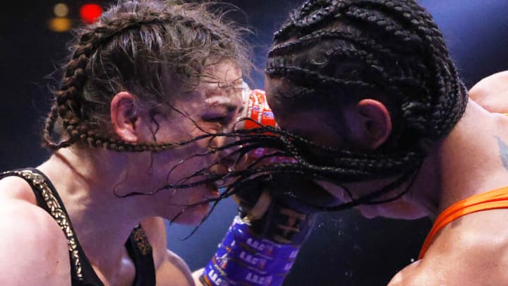 NEW YORK, NEW YORK - APRIL 30: Katie Taylor of Ireland (L) trades punches with Amanda Serrano of Puerto Rico (R) for the World Lightweight Title fight at Madison Square Garden on April 30, 2022 in New York, New York. This bout marks the first women’s boxing fight to headline Madison Square Garden in the venue’s history. Taylor defeated Serrano on a judges decision. (Photo by Sarah Stier/Getty Images)