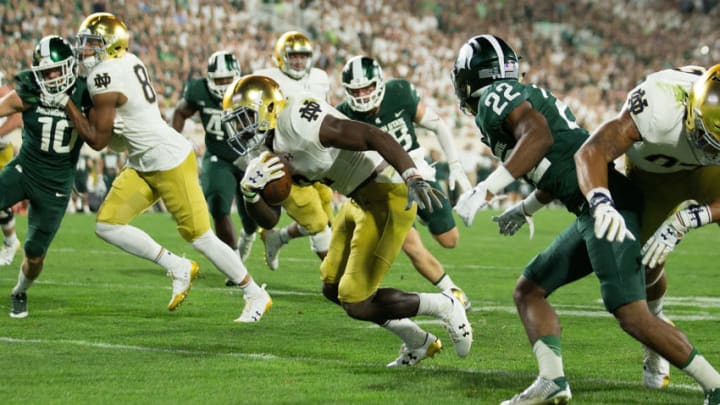 Notre Dame's Dexter Williams rushes against Michigan State football defense (Photo by Leon Halip/Getty Images)