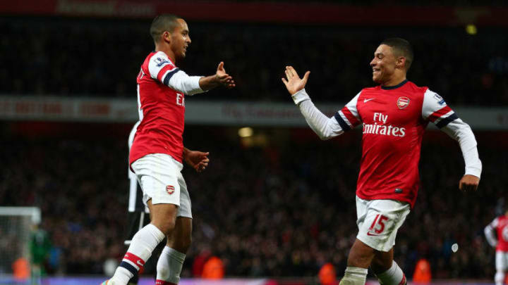 LONDON, ENGLAND - DECEMBER 29: Theo Walcott of Arsenal celebrates scoring their fourth goal with Alex Oxlade-Chamberlain of Arsenal during the Barclays Premier League match between Arsenal and Newcastle United at the Emirates Stadium on December 29, 2012 in London, England. (Photo by Clive Mason/Getty Images)
