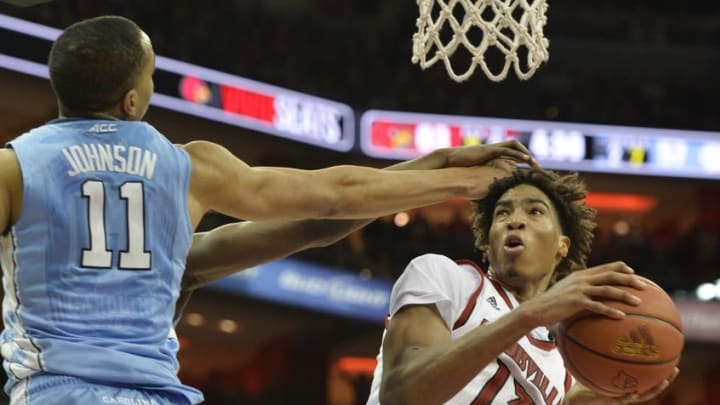 Feb 1, 2016; Louisville, KY, USA; Louisville Cardinals forward Raymond Spalding (13) shoots against North Carolina Tar Heels forward Brice Johnson (11) during the second half at KFC Yum! Center. Louisville defeated North Carolina 71-65. Mandatory Credit: Jamie Rhodes-USA TODAY Sports