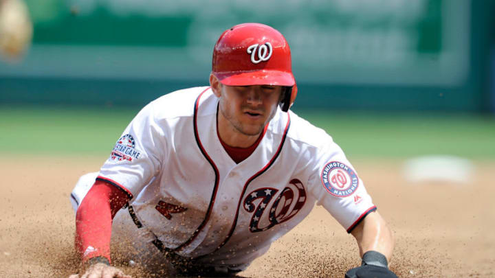WASHINGTON, DC - AUGUST 01: Trea Turner #7 of the Washington Nationals slides into third base against the New York Mets at Nationals Park on August 1, 2018 in Washington, DC. (Photo by G Fiume/Getty Images)