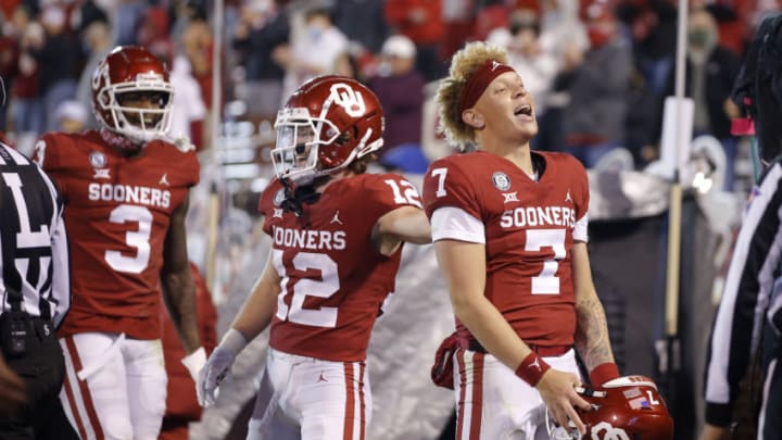 Nov 21, 2020; Norman, Oklahoma, USA; Oklahoma Sooners quarterback Spencer Rattler (7) celebrates after a throwing a touchdown against the Oklahoma State Cowboys at Gaylord Family-Oklahoma Memorial Stadium. Mandatory Credit: Bryan Terry/The Oklahoman via USA TODAY Sports