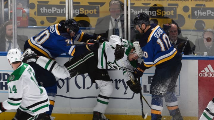 ST. LOUIS, MO - APRIL 25: Oskar Sundqvist #70 of the St. Louis Blues and Brayden Schenn #10 of the St. Louis Blues check Roope Hintz #24 of the Dallas Stars in Game One of the Western Conference Second Round during the 2019 NHL Stanley Cup Playoffs at Enterprise Center on April 25, 2019 in St. Louis, Missouri. (Photo by Joe Puetz/NHLI via Getty Images)