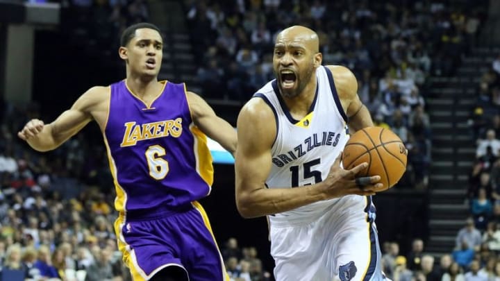 Feb 24, 2016; Memphis, TN, USA; Memphis Grizzlies guard Vince Carter (15) dribbles around Los Angeles Lakers guard Jordan Clakson (6) at FedExForum. Memphis defeated Los Angeles 128-119. Mandatory Credit: Nelson Chenault-USA TODAY Sports