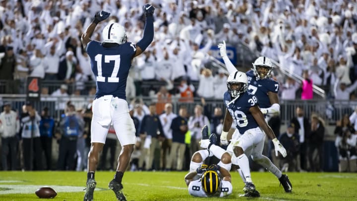 UNIVERSITY PARK, PA – OCTOBER 19: Garrett Taylor #17, Lamont Wade #38 and Jaquan Brisker #7 of the Penn State Nittany Lions celebrate a fourth down stop in the final minutes of the game against the Michigan Wolverines on October 19, 2019 at Beaver Stadium in University Park, Pennsylvania. Penn State defeats Michigan 28-21. (Photo by Brett Carlsen/Getty Images)