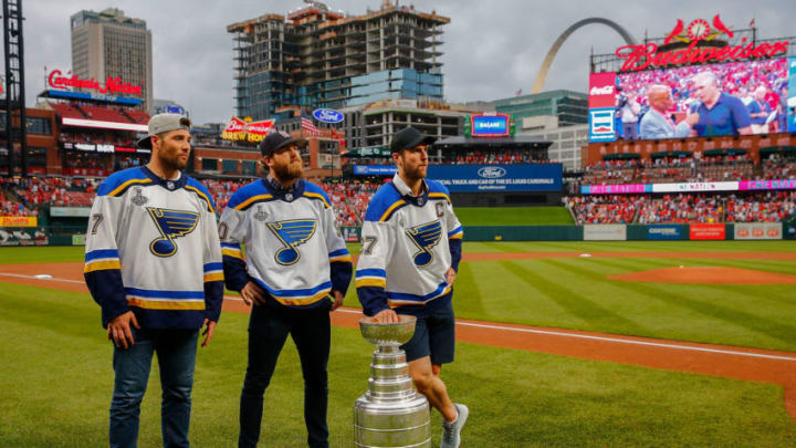 ST LOUIS, MO - JUNE 26: Pat Maroon #7, Ryan OReilly #90 and Alex Pietrangelo #27 of the St. Louis Blues take part in a pre-game ceremony with the Stanley Cup prior to a game between the St. Louis Cardinals and the Oakland Athletics at Busch Stadium on June 26, 2019 in St Louis, Missouri. (Photo by Dilip Vishwanat/Getty Images)