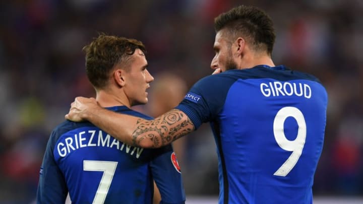 TOPSHOT - France's forward Olivier Giroud (R) celebrates with France's forward Antoine Griezmann after he scored a penalty shot giving France the first goal of the match during the Euro 2016 semi-final football match between Germany and France at the Stade Velodrome in Marseille on July 7, 2016. / AFP / PATRIK STOLLARZ (Photo credit should read PATRIK STOLLARZ/AFP/Getty Images)