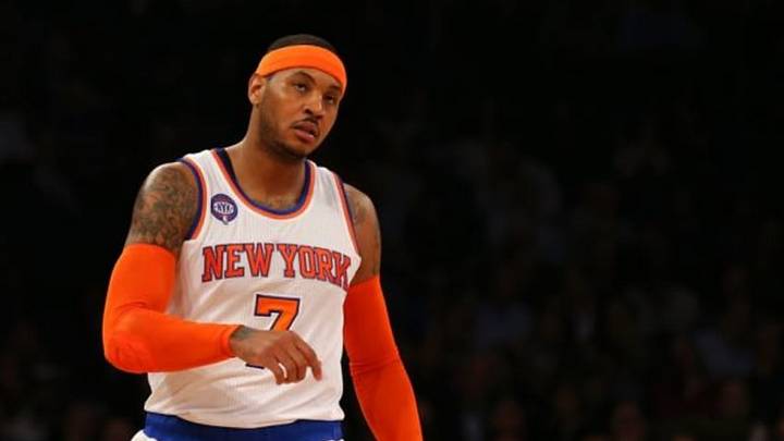Dec 2, 2014; New York, NY, USA; New York Knicks forward Carmelo Anthony (7) reacts from the court against the Brooklyn Nets during the first quarter at Madison Square Garden. Mandatory Credit: Adam Hunger-USA TODAY Sports