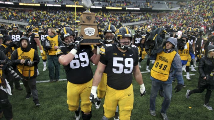 Offensive linemen Keegan Render #69 and Ross Reynolds #59 of the Iowa Hawkeyes (Photo by Matthew Holst/Getty Images)