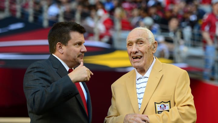 Dec. 16, 2012; Glendale, AZ, USA: Pro Football Hall of Fame member Charley Trippi on the sidelines with Arizona Cardinals president Michael Bidwill against the Detroit Lions game at University of Phoenix Stadium. Mandatory Credit: Mark J. Rebilas-USA TODAY Sports