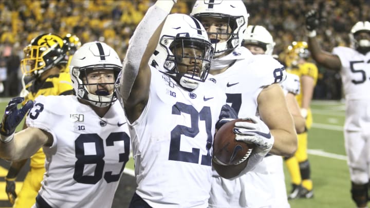 IOWA CITY, IOWA- OCTOBER 12: Running back Noah Cain #21 of the Penn State Nittany Lions celebrates a touchdown with tight ends Nick Bowers and Pat Freiermuth #87 in the second half against the Iowa Hawkeyes, on October 12, 2019 at Kinnick Stadium in Iowa City, Iowa. (Photo by Matthew Holst/Getty Images)