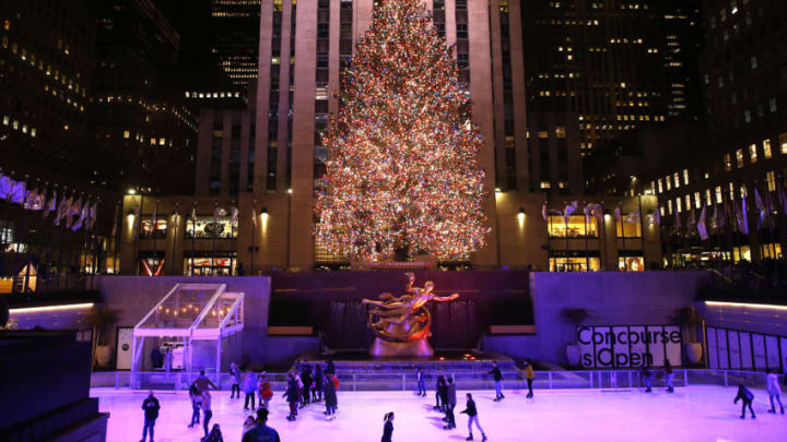 NEW YORK, NEW YORK - DECEMBER 16: People skate in front of the Rockefeller Christmas Tree in Midtown on December 16, 2021 in New York City. (Photo by John Lamparski/Getty Images)