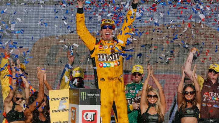 PHOENIX, AZ - NOVEMBER 11: Kyle Busch, driver of the #18 M&M's Toyota, celebrates in Victory Lane after winning the Monster Energy NASCAR Cup Series Can-Am 500 at ISM Raceway on November 11, 2018 in Phoenix, Arizona. (Photo by Jonathan Ferrey/Getty Images)