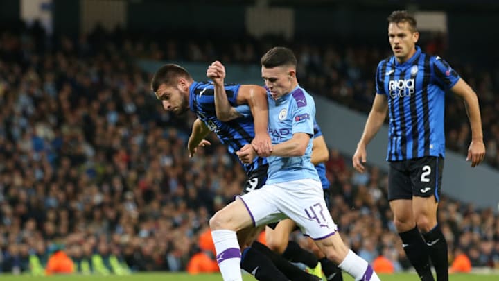 MANCHESTER, ENGLAND - OCTOBER 22: Phil Foden of Manchester City battles for possession with Berat Djimsiti of Atalanta during the UEFA Champions League group C match between Manchester City and Atalanta at Etihad Stadium on October 22, 2019 in Manchester, United Kingdom. (Photo by Jan Kruger/Getty Images)