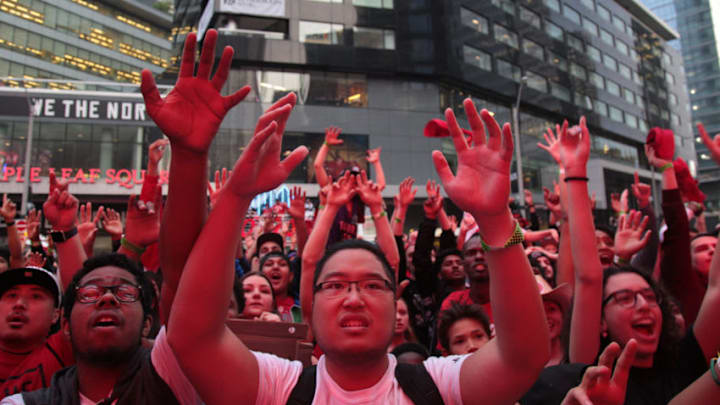 TORONTO, CANADA - MAY 30: Toronto Raptors fans cheer in "Jurrasic Park" during Game One of the NBA Finals between the Golden State Warriors and the Toronto Raptors on May 30, 2019 at Scotiabank Arena in Toronto, Ontario, Canada. NOTE TO USER: User expressly acknowledges and agrees that, by downloading and/or using this photograph, user is consenting to the terms and conditions of the Getty Images License Agreement. Mandatory Copyright Notice: Copyright 2019 NBAE (Photo by Elijah Nichols/NBAE via Getty Images)