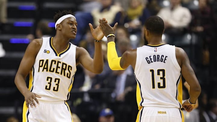 Jan 1, 2017; Indianapolis, IN, USA; Indiana Pacers forward Paul George (13) high fives center Myles Turner (33) after a play against the Orlando Magic at Bankers Life Fieldhouse. Mandatory Credit: Brian Spurlock-USA TODAY Sports