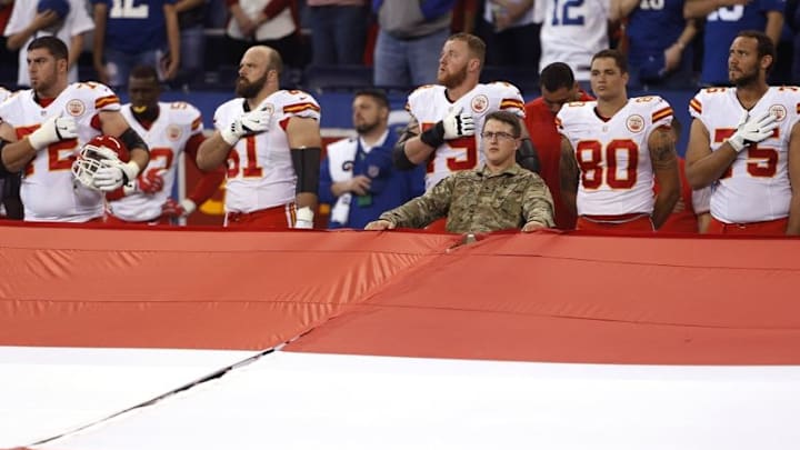 Oct 30, 2016; Indianapolis, IN, USA; Kansas City Chiefs stand at attention during the playing of the National Anthem before the game against the Indianapolis Colts at Lucas Oil Stadium. Mandatory Credit: Brian Spurlock-USA TODAY Sports