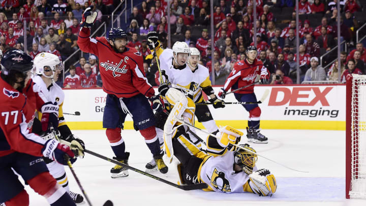 WASHINGTON, DC – NOVEMBER 07: T.J. Oshie #77 of the Washington Capitals scores a goal against Casey DeSmith #1 of the Pittsburgh Penguins in the third period at Capital One Arena on November 7, 2018 in Washington, DC. (Photo by Patrick McDermott/NHLI via Getty Images)